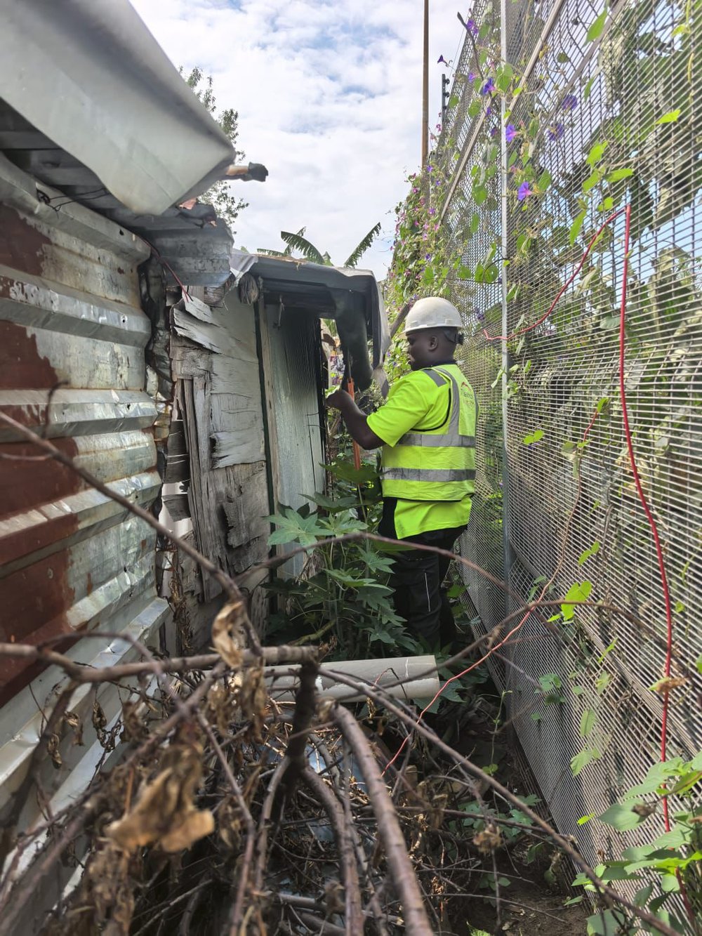 Officials remove illegal electricity connections during a joint operation at Ehlanzeni Cemetery and surrounding areas in Tembisa, where about 3,000 unlawful connections were disconnected.