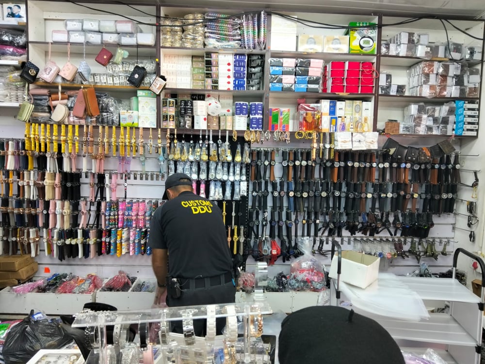 SAPS Police display some of the counterfeit goods confiscated during a multi-agency operation in Musina and Thohoyandou.