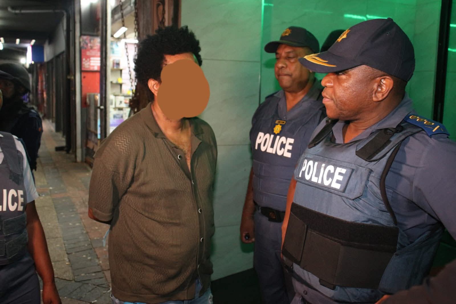 Nhlanhla Mkhwanazi oversees a multi-disciplinary police operation in Durban’s Point area on Friday night, 13 February, which led to the closure of an illegal pub and multiple arrests. Photos SAPS